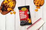 the bag displayed on a white wood background with the ingredients in the top left corner and a pile of crisps in the top right